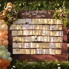 For a book-themed baby shower, I designed this unique 'New Chapter' wall featuring open books and delicate flowers. It’s an example of how I love to build creative, interactive photo backdrops that perfectly match your story.