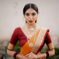 A timeless South Indian bridal portrait. I focused on her elegant posture and the rich colors of her Kanjeevaram saree, using natural light to highlight the intricate details of her temple jewellery.