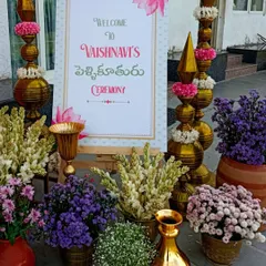 A beautiful floral welcome sign for a Pellikuthuru ceremony, the traditional Telugu event that beautifies the bride-to-be. We used a mix of tuberoses and purple asters for a fresh and elegant look.