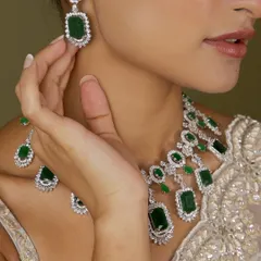 A beautiful emerald and diamond-look set, crafted for those timeless moments. This image shows the delicate earrings that complete the ensemble.
