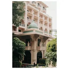 The majestic facade of The Leela Palace in Bengaluru. Its regal architecture provides a breathtaking backdrop for a luxurious and timeless wedding celebration.
