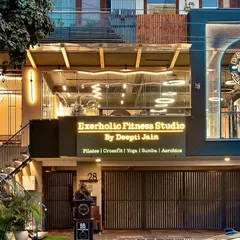 Another view of our studio's exterior at dusk. The warm lighting and clear view into the studio create an inviting and professional first impression.