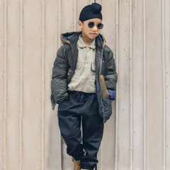 This young man has so much style! An outdoor portrait against a simple background really makes his cool outfit and personality pop.