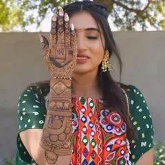 A closer look at one of my arms, featuring elephant motifs and a personalized design on the palm.