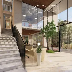 The double-height reception area концепт for Nandi Souls, a boutique weekend home project in Bangalore. The design uses natural light, indoor greenery, and a grand staircase to create a welcoming sense of arrival.