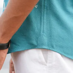 A detail shot of the gusset on our teal panther shirt. This small, reinforced piece of fabric is a hallmark of high-quality shirtmaking, ensuring durability and a clean finish at the side seam.