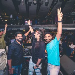 Celebrating a successful set with the crew. The energy is always high, both on and off the stage, with the entire club vibing together.