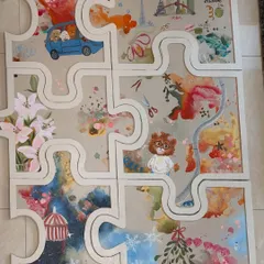 This artwork was designed as a set of interlocking puzzle pieces for a couple in Mumbai. Each piece tells a small story from their journey together, with illustrations of Paris, their dog, and other personal memories.