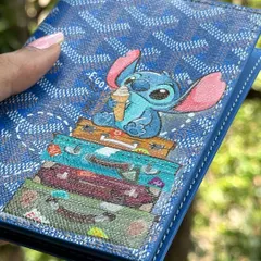 It's not just about sneakers. I love getting to paint on different things, like this Goyard passport cover. The challenge was to paint a super cute Stitch on the textured canvas, complete with tiny travel bags. It’s the perfect accessory for your next adventure.