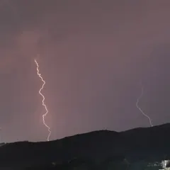 This shot captures the storm as it moved over the hills. I used a long exposure to capture these distinct, powerful bolts of lightning as they lit up the night.