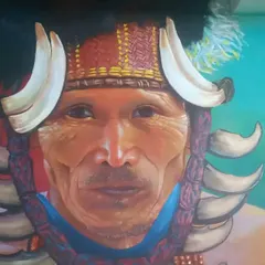 This realistic portrait of a tribal elder is an example of my focus on cultural narratives and ancestral memory. Executed on a university wall, the piece captures the subject's dignity and connection to heritage, using acrylics to achieve depth and lifelike detail.