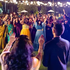 The best parties are when everyone, from your college friends to your grandparents, is on the dance floor. This shot from a beautiful lakeside sangeet in Bangalore captures the pure, uninhibited joy we aim to create, where the energy of the crowd is absolutely electric.