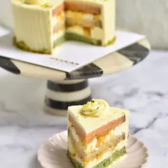 Our Pistachio, Saffron, and Orange cake is a tribute to the flavours of India. With layers of pistachio sponge, orange marmalade, and saffron-infused cream, it's a colourful and joyful cake perfect for any celebration.