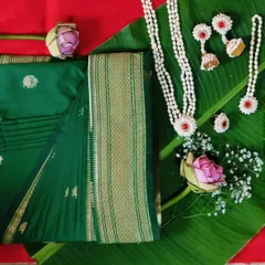 A traditional Maharashtrian baby shower (dohale jevan) look. I pre-pleated this green saree and it was styled beautifully with floral jewelry for the lovely mom-to-be.
