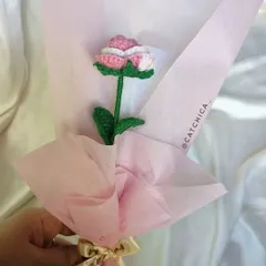A single, elegant crochet rose with two-tone pink and white petals. Wrapped in soft pink paper, this is a timeless gift of affection that will never wilt.