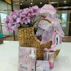 A lovely pink-themed hamper in a Kauna grass basket. This self-care set includes a notebook, scrunchies, a makeup sponge set, and is perfect for a bride-to-be or for a birthday.