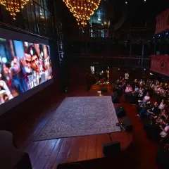 A full house at The Piano Man for our ZNMD screening. The grand chandeliers and tiered seating ensure every guest is captivated by the film, creating a collective experience where laughter and applause are shared over delicious food.