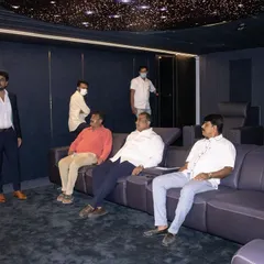 Here I am walking clients through a newly completed home cinema. I handle the entire process, ensuring every element from the luxury seating to the hidden speakers works together perfectly.