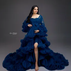 Pure happiness in blue. This gorgeous ruffled gown in a deep royal blue makes a powerful and elegant statement, perfectly capturing the joy of this special time.