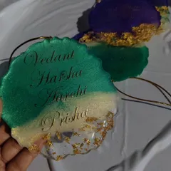 Another look at the family name car hanging, showing the geode-style edge and the shimmer of the green resin.