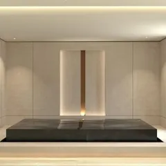 We designed this serene entrance to bring a sense of calm and positivity into the home. A central water feature, framed by clean lines and subtle lighting, creates a peaceful transition from the outside world.