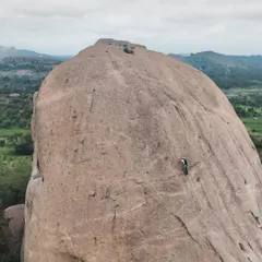 Faith and climbing intersect at Gaali Kallu. Local villagers believe a rock formation on the spire is a statue of the bull-god Basava. We were honored to help them hoist a flag to the top, a strange and invigorating experience.
