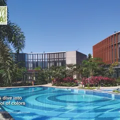 The swimming pool at the ICC project is a perfect example of how we use color and form to create a vibrant landscape feature. The patterned tile work and surrounding lush greenery make this pool a central point of attraction and leisure for the community.