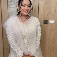 A celestial-themed sangeet or reception look. I created a textured, curly ponytail to go with her ethereal white outfit.