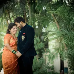 A sweet portrait of the newly married couple holding hands in a quiet garden, enjoying their first moments as husband and wife.