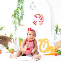 This little chef is ready to cook up some fun for her first birthday photoshoot. Themed sessions like this are a great way to celebrate milestones with creativity.