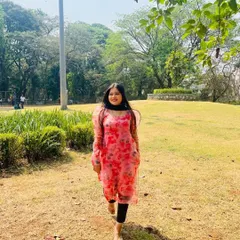 A happy client enjoying a sunny day in a pink floral organza kurta I designed. The sheer sleeves with a slight puff add a trendy touch to this comfortable and pretty outfit.