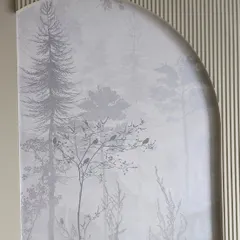 A misty forest scene wallpaper installed inside an arched niche in Sewri. This creates a beautiful, framed piece of art that adds depth and character to the wall.