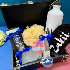 A fully customised birthday hamper for him. This personalised trunk box includes a custom eye mask, sipper, and keychain, along with Nivea body wash, a bracelet, and pocket perfume.