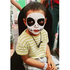 A spooky and fun full-face skeleton, perfect for Halloween parties or themed events. This look is created with high-contrast, non-toxic black and white paint for a dramatic effect.
