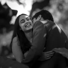I believe the most beautiful moments are the unscripted ones. This candid, black and white portrait focuses on pure, unrestrained laughter, capturing the genuine joy and comfort you find in each other's arms.