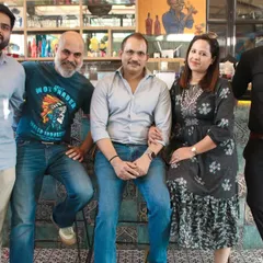 A group of friends enjoying a get-together at a restaurant. I cover casual parties and social gatherings as well as birthdays.