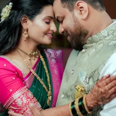 An intimate portrait of a Maharashtrian couple, lost in their own world. This photo highlights our ability to capture quiet, tender moments amidst the wedding celebrations, focusing on the couple's connection.