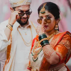 A fun and modern portrait of the couple with sunglasses, showing off their cool and playful side.