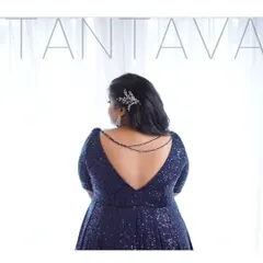 It's all about the details. This classy navy blue sequin gown features a deep V-back, elegantly accented with delicate beaded chains for a touch of glamour, perfect for a cocktail night or reception.
