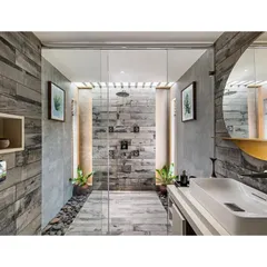 This bathroom in "The Far Site House" uses wood-finish tiles and river pebbles to create a rustic, nature-inspired look. The walk-in shower with a rain shower head adds a touch of modern luxury.