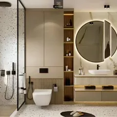A stylish bathroom with terrazzo-style flooring and walls. The design includes a floating vanity, a round backlit mirror, and open wooden shelving for a modern and airy feel.