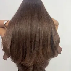 A great haircut is everything. Here, we created long, flowing layers to give this beautiful hair shape and volume, making it look fuller and healthier. This kind of cut is perfect for showing off a fresh color.