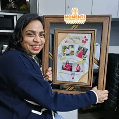 A happy customer with her new double-layer birthday frame. This design is very popular for gifting to bosses, colleagues, and family members, offering a modern and personal touch.