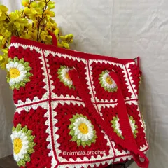 Another angle of the daisy tote, highlighting the texture and craftsmanship of the crochet work.