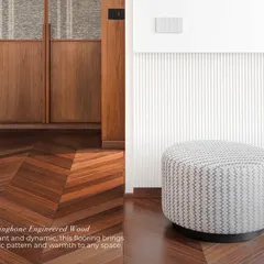 Flooring is the foundation of a design. This elegant and dynamic herringbone engineered wood floor brings a classic pattern and incredible warmth to the space, grounding the design with its rich tones.