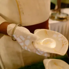An empty serving dish, ready to be filled with a culinary creation. Our team ensures every piece of crockery is pristine, setting the stage for a perfect food presentation.