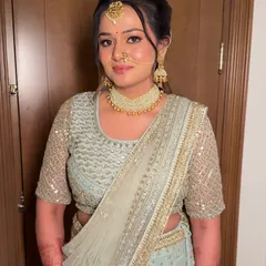 A vision in pastels. This bride's look was all about soft, striking elegance, with shimmer-kissed lids, rose-tinted lips, and a flawless base that made her bloom.