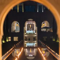 A view through an archway of the candlelit canal leading to the reception dinner, creating a magical and dramatic entrance.