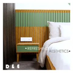 A render focusing on the bedside table and headboard, illustrating our concept for a refreshing aesthetic using green and natural wood tones.