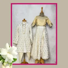For a ghar ki shaadi or Diwali, nothing beats the elegance of our Mogra collection. We designed this coordinated brother-sister set in classic white and gold for a timeless festive look.
